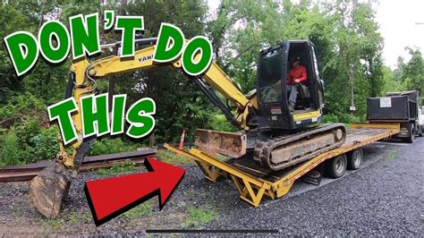 how to unload a mini excavator|youtube excavator 101 loading.